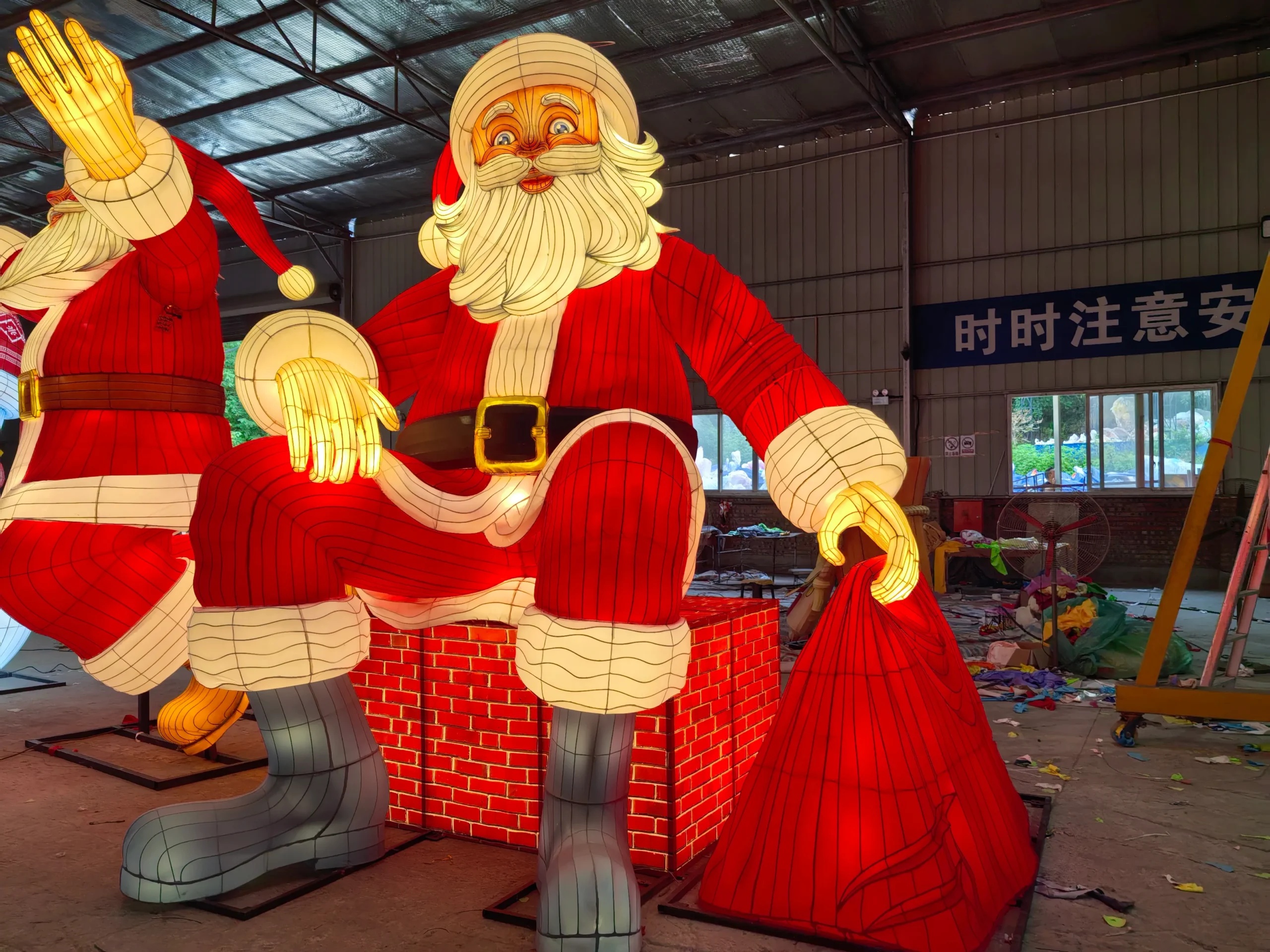 An illuminated Santa figure showing light beneath a fabric surface, from a separate project.